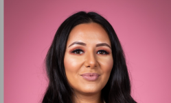 Headshot of Elena Manukyan on pink background