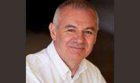 man with crewcut wearing a white shirt